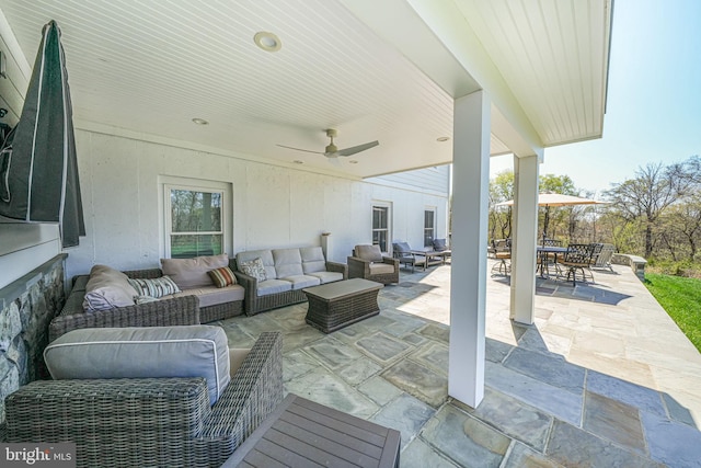 view of patio featuring outdoor dining space, outdoor lounge area, and ceiling fan