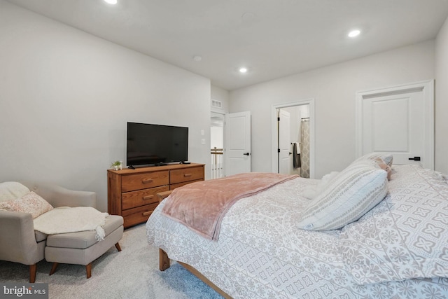 bedroom with recessed lighting and light colored carpet