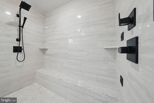 full bathroom featuring tiled shower