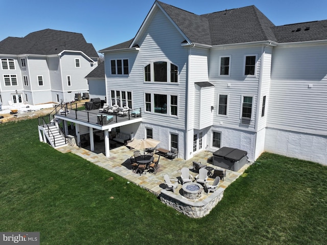back of property with a yard and a patio area