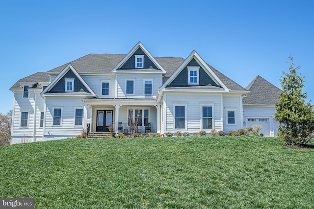 craftsman-style house with a porch, a garage, and a front yard