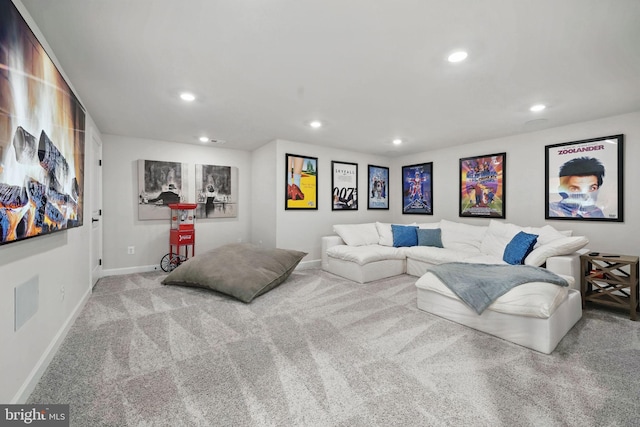 carpeted living room featuring baseboards and recessed lighting