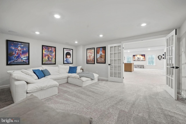 living area with french doors, baseboards, recessed lighting, and carpet