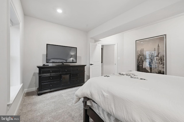 bedroom with recessed lighting and light carpet