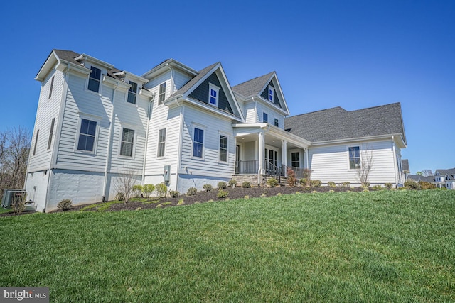 craftsman-style home with a front lawn and covered porch