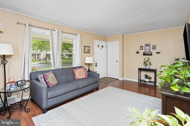 1 Pheasant Ln, Hamilton, NJ 08690 - living area with dark wood finished floors, crown molding, and baseboards