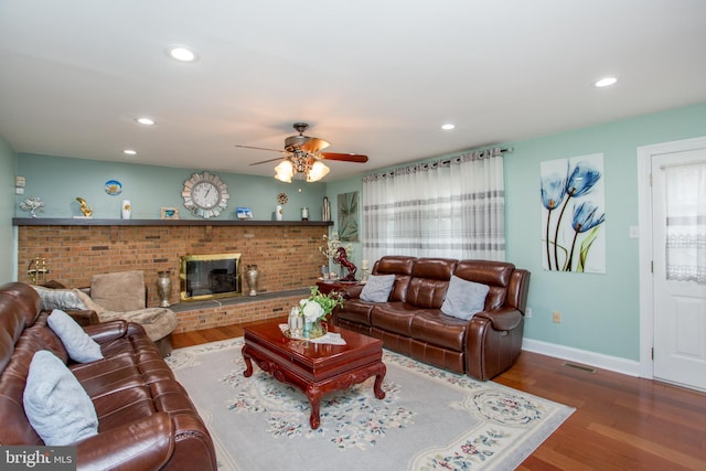 living room featuring visible vents, a ceiling fan, wood finished floors, and recessed lighting