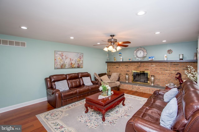living room featuring recessed lighting, visible vents, wood finished floors, and ceiling fan