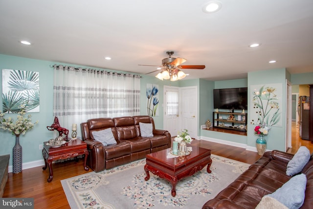 living room with wood finished floors, ceiling fan, baseboards, and recessed lighting