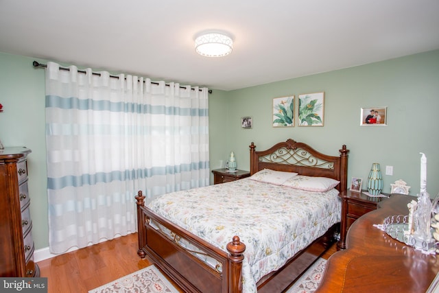 bedroom with wood finished floors