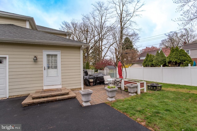 view of yard featuring fence and a patio
