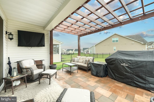 view of patio / terrace with an outdoor living space, a pergola, and a fenced backyard