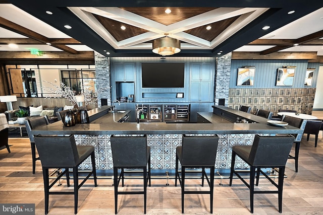interior space with coffered ceiling, wood finished floors, beam ceiling, and recessed lighting