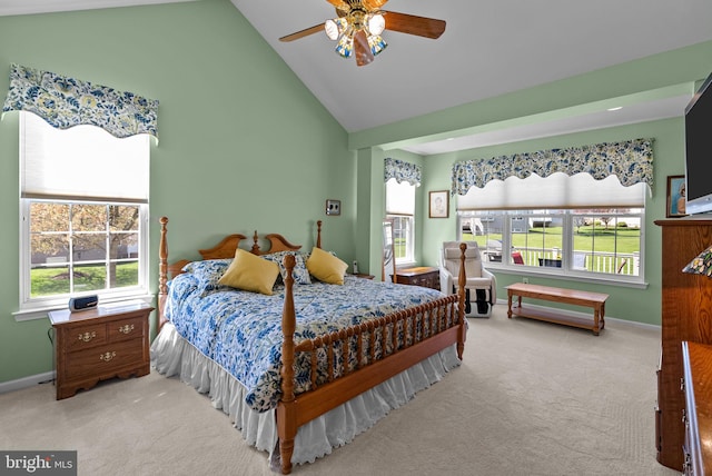 bedroom featuring carpet flooring, multiple windows, baseboards, and high vaulted ceiling