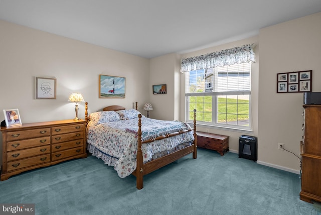 carpeted bedroom featuring baseboards