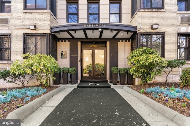 1010 25th St NW Unit 405, Washington, DC 20037 - view of exterior entry featuring french doors and brick siding