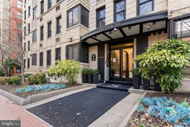 1010 25th St NW Unit 405, Washington, DC 20037 - view of exterior entry featuring french doors and brick siding