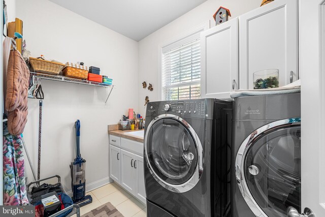 1430 County Line Rd, Bryn Mawr, PA 19010 - clothes washing area featuring light tile patterned floors, independent washer and dryer, baseboards, and cabinet space