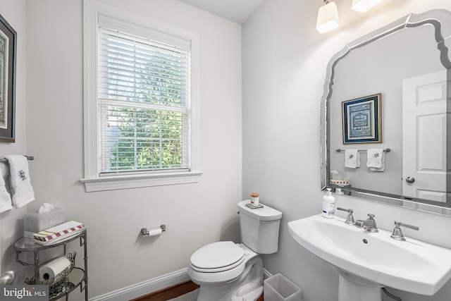 1430 County Line Rd, Bryn Mawr, PA 19010 - half bathroom with toilet, a sink, and baseboards