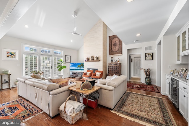 1430 County Line Rd, Bryn Mawr, PA 19010 - living room featuring visible vents, beverage cooler, a ceiling fan, a large fireplace, and hardwood / wood-style floors