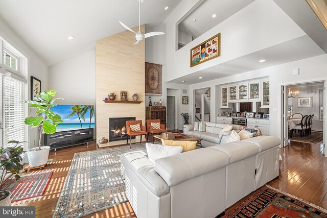 1430 County Line Rd, Bryn Mawr, PA 19010 - living room featuring high vaulted ceiling, a ceiling fan, a premium fireplace, wine cooler, and hardwood / wood-style flooring