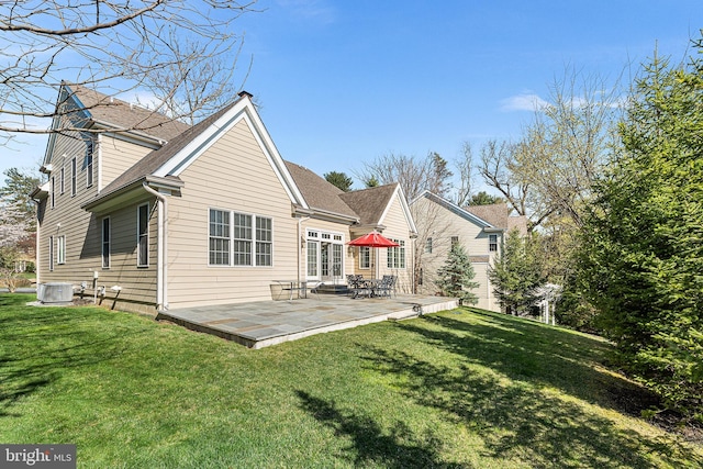 1430 County Line Rd, Bryn Mawr, PA 19010 - rear view of property with cooling unit, a shingled roof, and a lawn