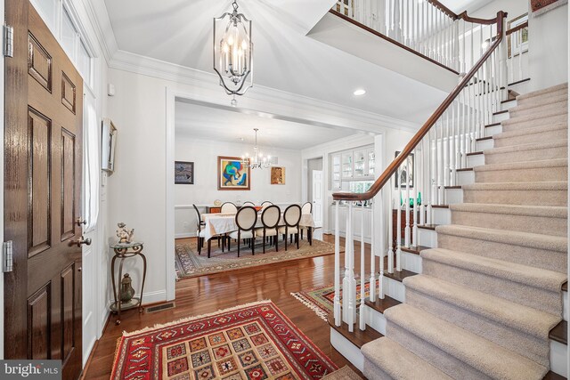 1430 County Line Rd, Bryn Mawr, PA 19010 - entryway with baseboards, an inviting chandelier, stairs, visible vents, and wood finished floors