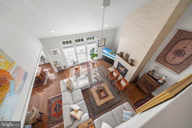 1430 County Line Rd, Bryn Mawr, PA 19010 - living area featuring a glass covered fireplace, recessed lighting, lofted ceiling, and wood finished floors