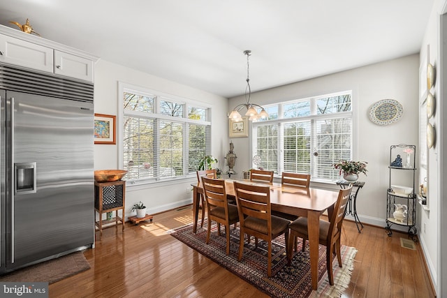1430 County Line Rd, Bryn Mawr, PA 19010 - dining room with baseboards, an inviting chandelier, and hardwood / wood-style flooring