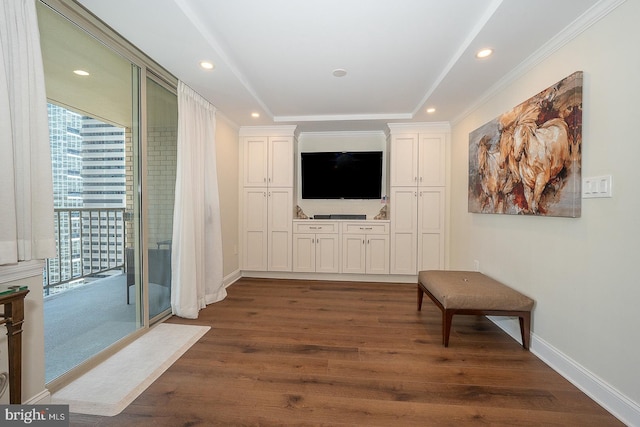 interior space with ornamental molding, baseboards, recessed lighting, and dark wood finished floors