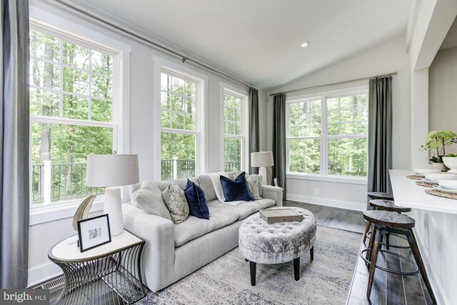 living room featuring recessed lighting, baseboards, wood finished floors, and lofted ceiling