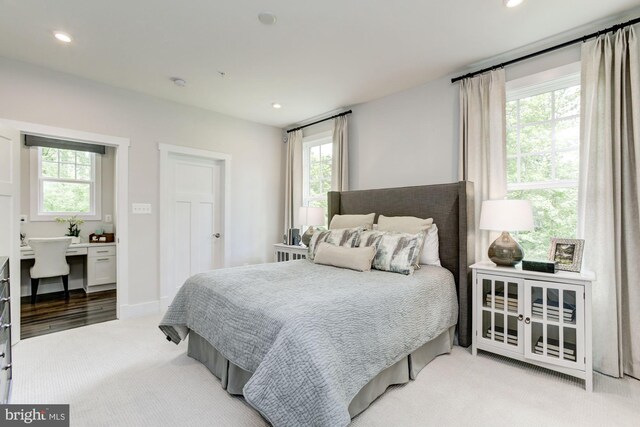 bedroom with light carpet, baseboards, and recessed lighting