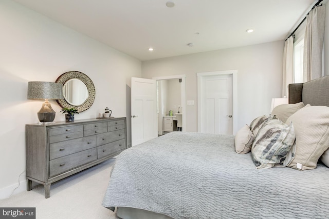 bedroom with baseboards, recessed lighting, and light colored carpet