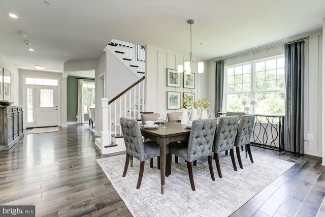 dining space with recessed lighting, stairs, baseboards, and dark wood finished floors