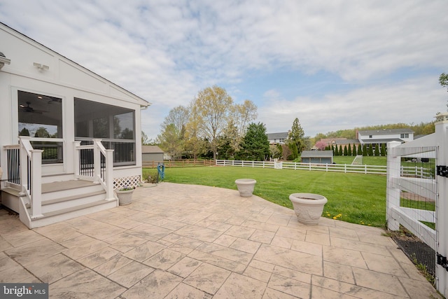 view of patio with a sunroom and a fenced backyard