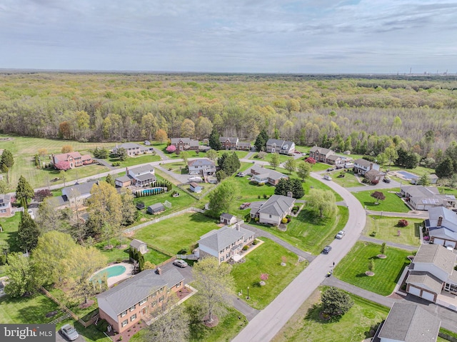 bird's eye view featuring a residential view and a view of trees
