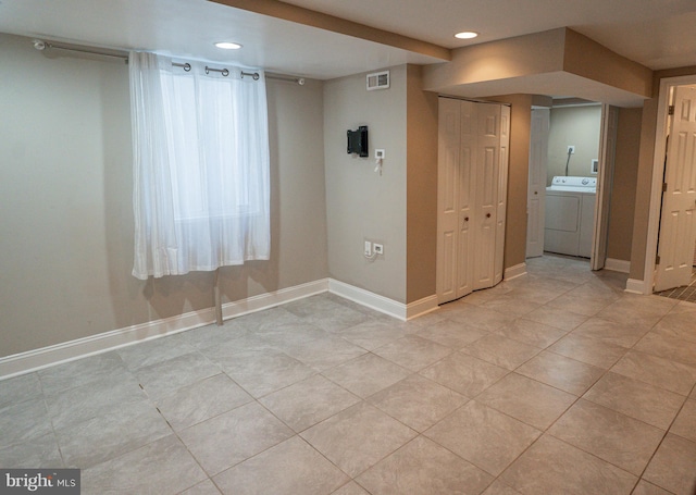 basement featuring light tile patterned flooring, recessed lighting, visible vents, and washer / dryer