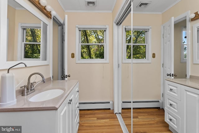 bathroom featuring visible vents, crown molding, and vanity