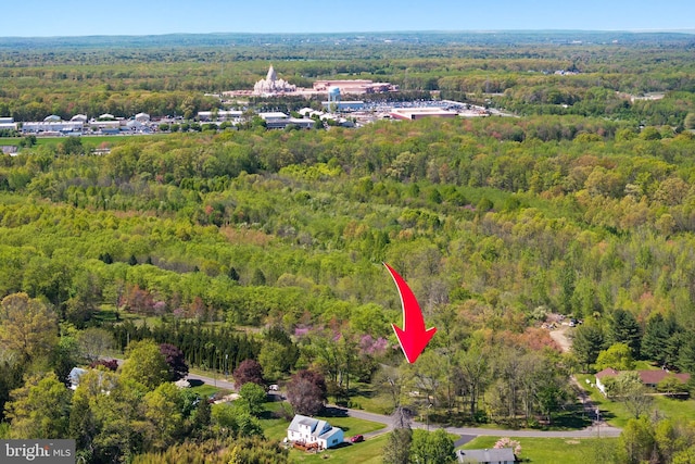 drone / aerial view with a view of trees
