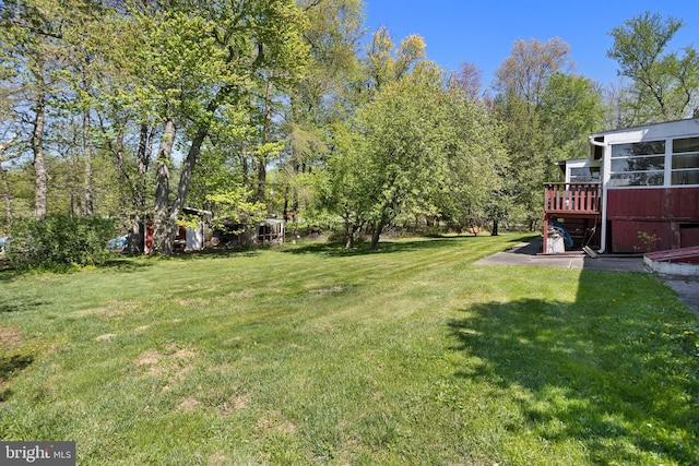 view of yard with a deck