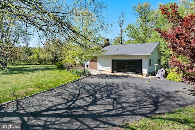 garage featuring driveway