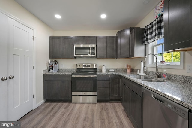 15 Mayflower Dr, Felton, DE 19943 - kitchen featuring light wood-style flooring, a sink, recessed lighting, light stone countertops, and appliances with stainless steel finishes