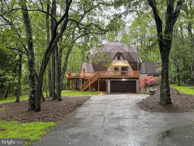 11035 Bennie Duncan Rd, Frederick, MD 21701 - view of front of home with driveway, stairs, an attached garage, a chimney, and a deck