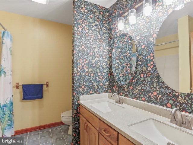 11035 Bennie Duncan Rd, Frederick, MD 21701 - bathroom with wallpapered walls, toilet, tile patterned flooring, double vanity, and baseboards