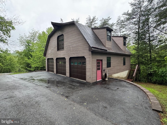 11035 Bennie Duncan Rd, Frederick, MD 21701 - view of side of property featuring a shingled roof and stairs