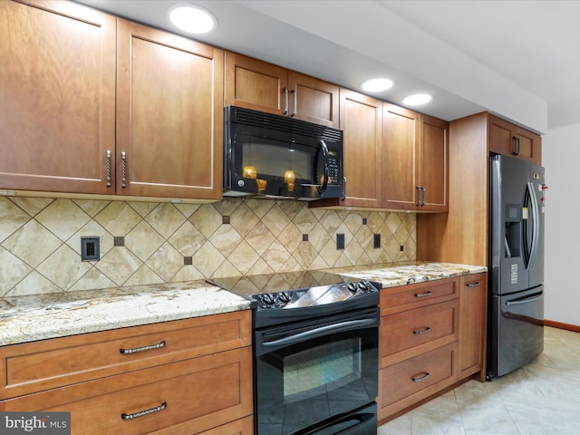 11035 Bennie Duncan Rd, Frederick, MD 21701 - kitchen with black appliances, brown cabinetry, light stone counters, backsplash, and recessed lighting