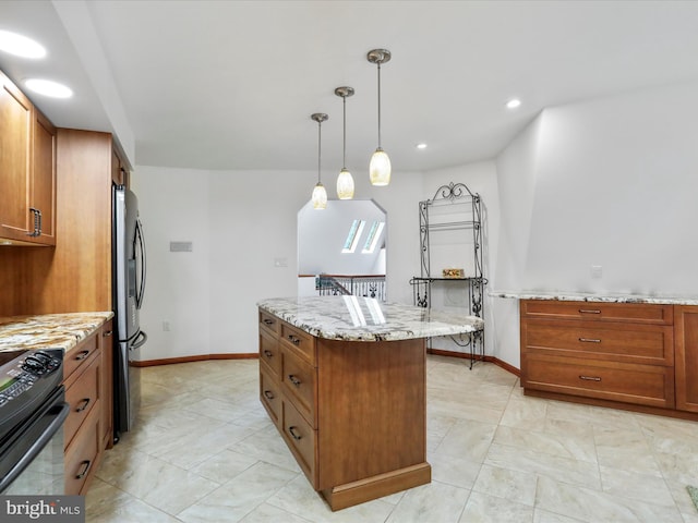 11035 Bennie Duncan Rd, Frederick, MD 21701 - kitchen with range, freestanding refrigerator, brown cabinetry, light stone counters, and a kitchen island