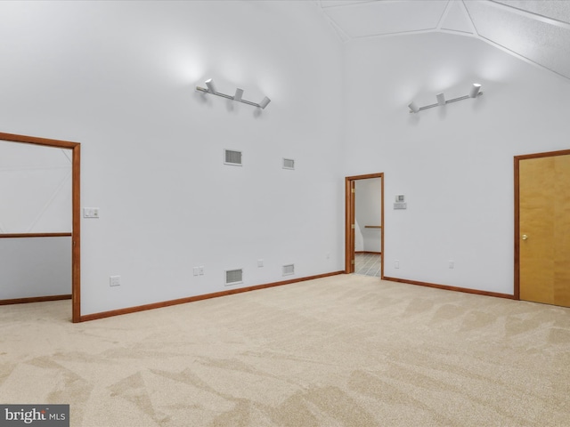 11035 Bennie Duncan Rd, Frederick, MD 21701 - spare room featuring high vaulted ceiling, carpet floors, and baseboards