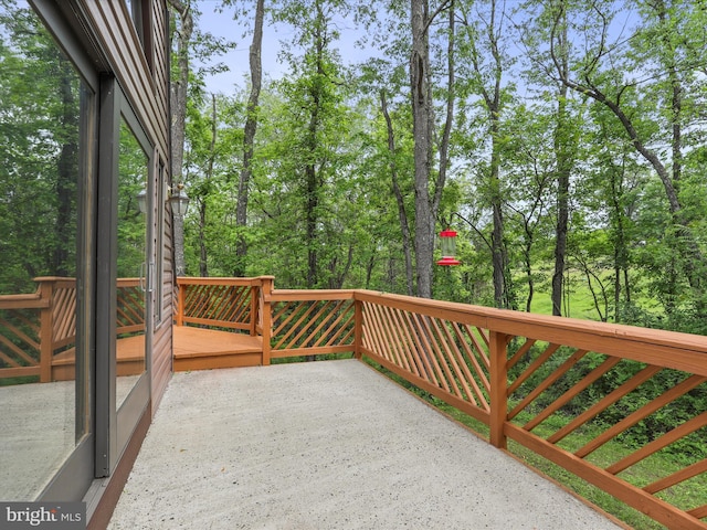 11035 Bennie Duncan Rd, Frederick, MD 21701 - wooden deck featuring a patio and view of wooded area