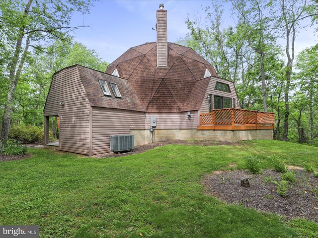 11035 Bennie Duncan Rd, Frederick, MD 21701 - rear view of house featuring central AC unit, a chimney, a yard, a wooden deck, and a gambrel roof